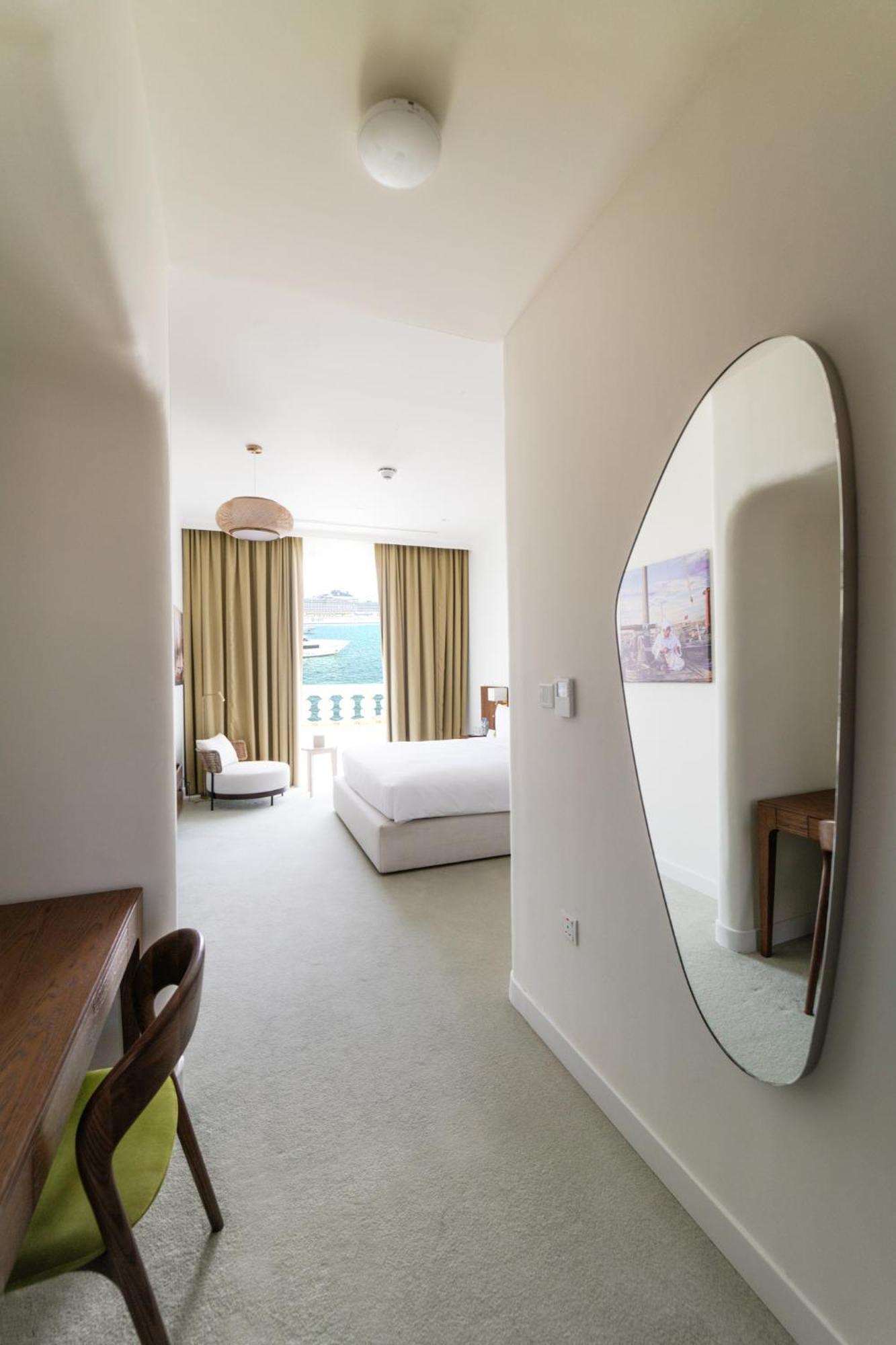 דוחה Mina Hotel And Residences By The Torch מראה חיצוני תמונה A bedroom at the hotel